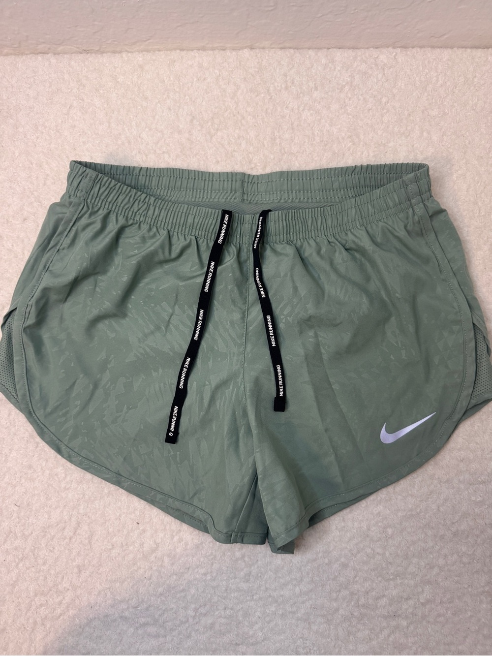 Nike Women's Sage Green Athletic Running Shorts with Black Drawstrings